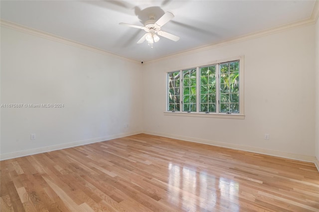 empty room with light wood-type flooring, ceiling fan, and crown molding