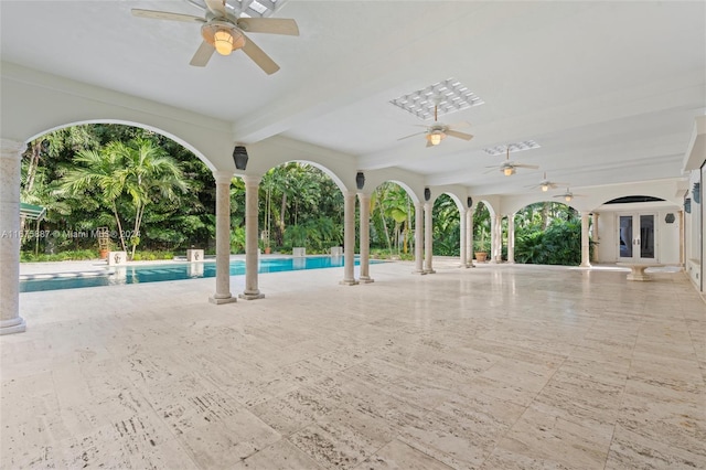 view of swimming pool featuring a patio and ceiling fan