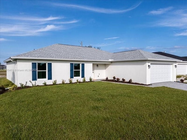 ranch-style house featuring a garage and a front lawn