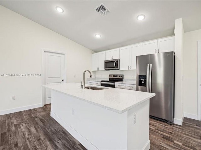 kitchen with appliances with stainless steel finishes, sink, a center island with sink, and white cabinets