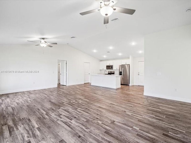 unfurnished living room featuring ceiling fan, wood-type flooring, and vaulted ceiling