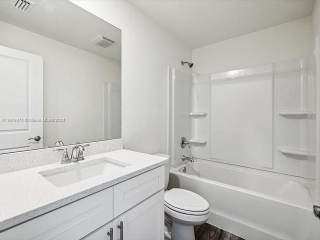 full bathroom with vanity, toilet, wood-type flooring, and tub / shower combination