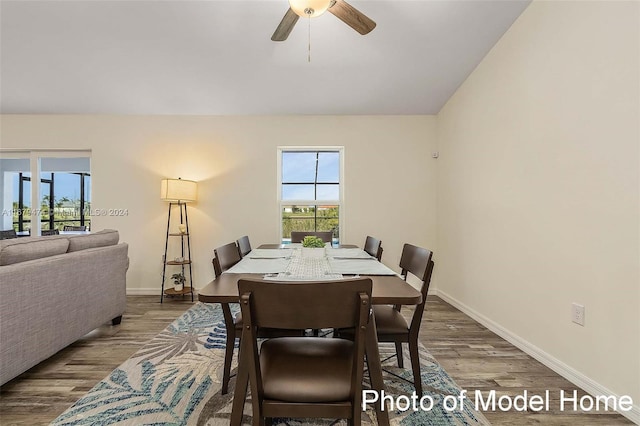 dining area with hardwood / wood-style floors and ceiling fan