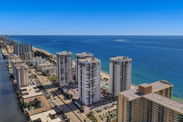 bird's eye view with a water view and a beach view