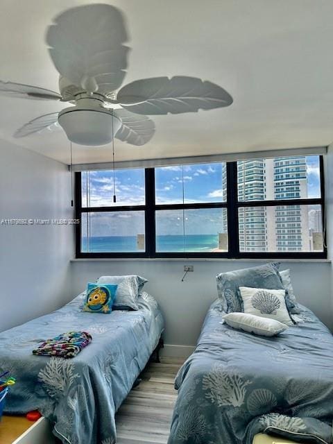 bedroom featuring ceiling fan and light hardwood / wood-style flooring