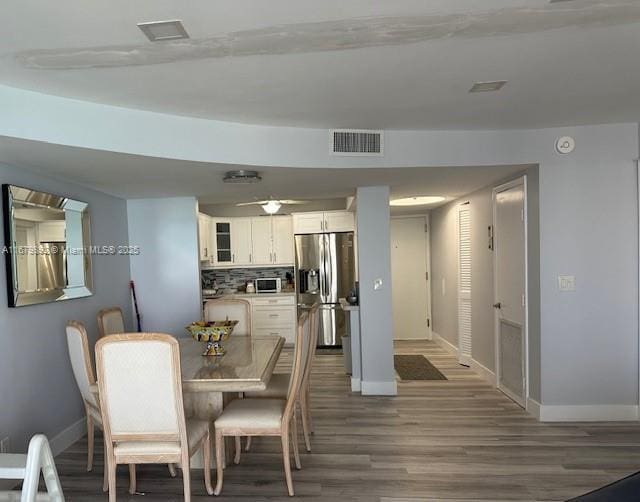 dining room featuring wood-type flooring