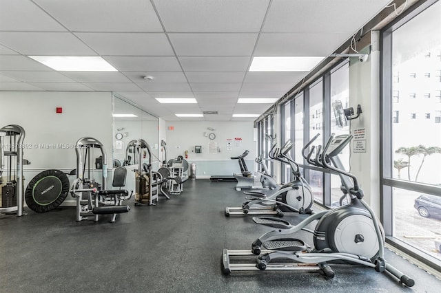 workout area featuring a paneled ceiling