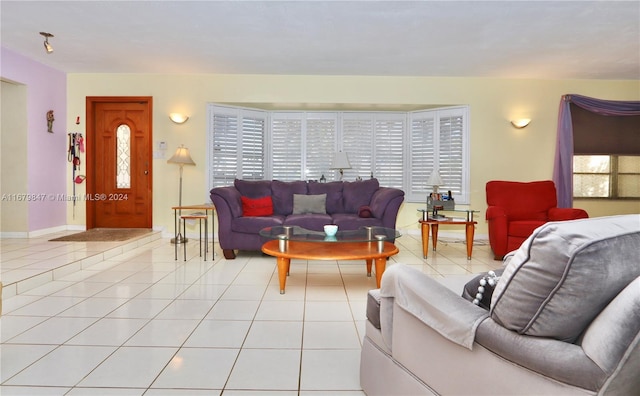 living room with a healthy amount of sunlight and light tile patterned floors