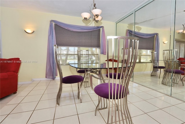 tiled dining area with a notable chandelier