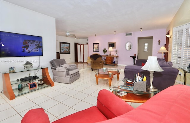 tiled living room with ceiling fan