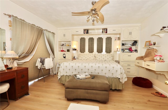 bedroom with ceiling fan and light wood-type flooring