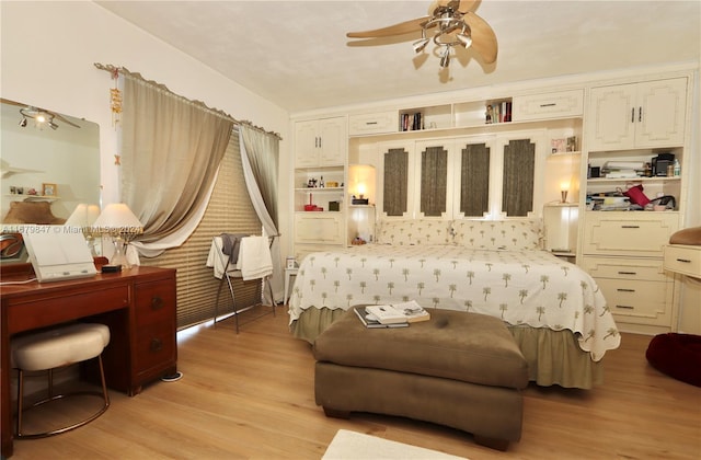 bedroom featuring ceiling fan and light hardwood / wood-style flooring