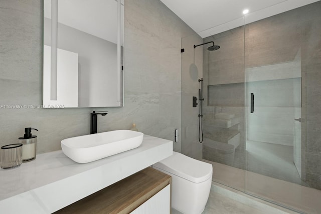 bathroom featuring a stall shower, decorative backsplash, toilet, vanity, and tile walls