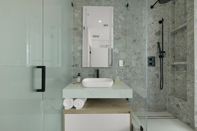 full bath featuring a stall shower and vanity