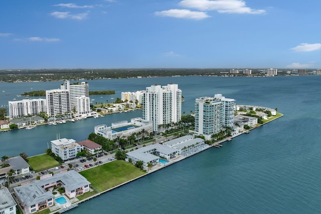 drone / aerial view featuring a water view and a city view