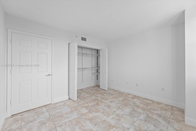 unfurnished bedroom featuring a closet