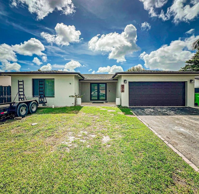 view of front of property with a garage and a front yard