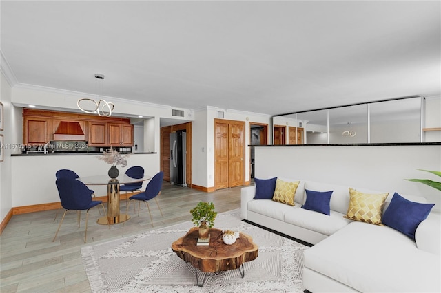 living room with crown molding and light wood-type flooring