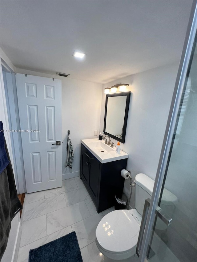 bathroom featuring marble finish floor, visible vents, vanity, and toilet