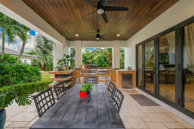 view of patio / terrace featuring area for grilling, grilling area, and ceiling fan