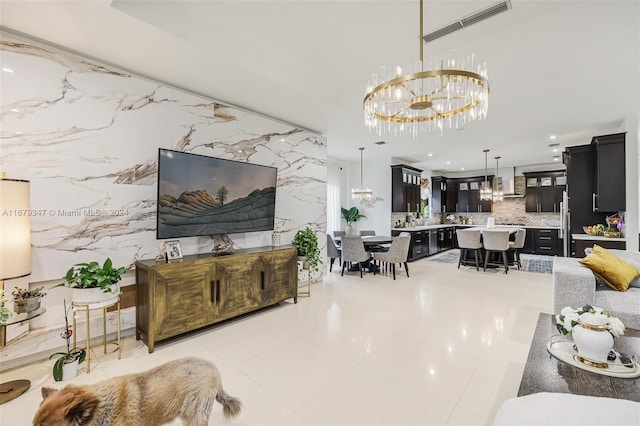 tiled living room with a chandelier