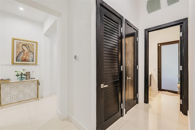 hallway with light tile patterned floors