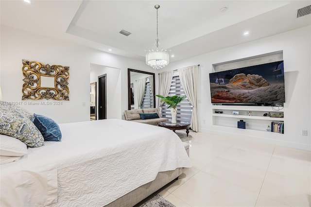 bedroom with an inviting chandelier and tile patterned flooring