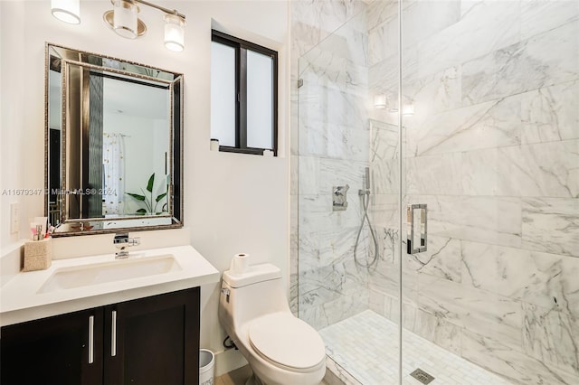 bathroom with vanity, toilet, and an enclosed shower