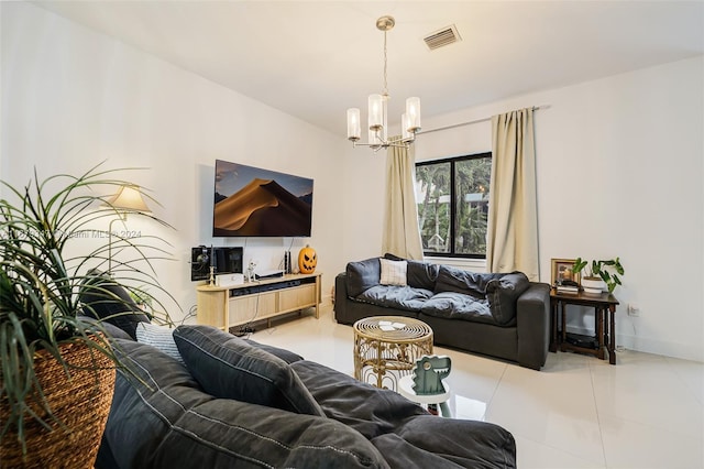 living room featuring an inviting chandelier and light tile patterned floors