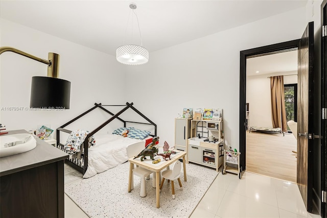 tiled bedroom with sink