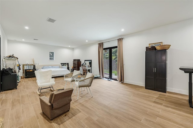 bedroom featuring access to outside and light wood-type flooring