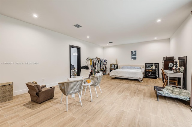 bedroom with light hardwood / wood-style floors