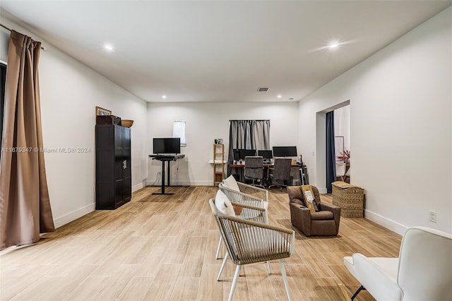 living room with light hardwood / wood-style floors