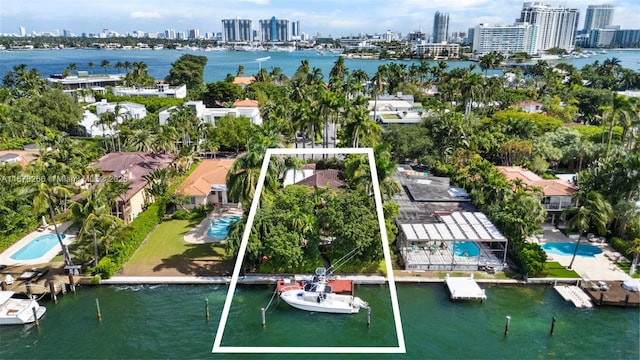 bird's eye view with a water view and a view of city