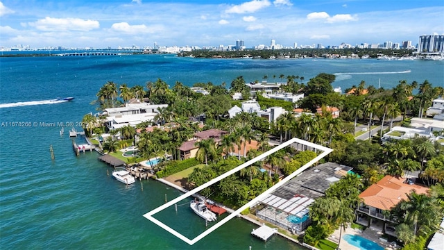 aerial view featuring a water view and a city view