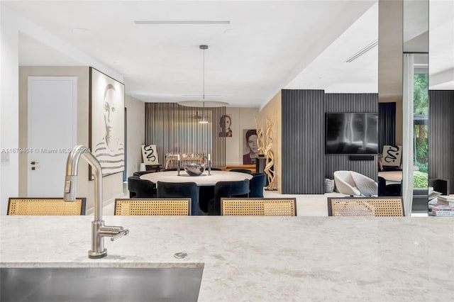 kitchen featuring sink and decorative light fixtures