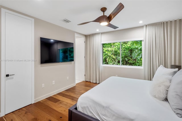 bedroom featuring wood-type flooring and ceiling fan