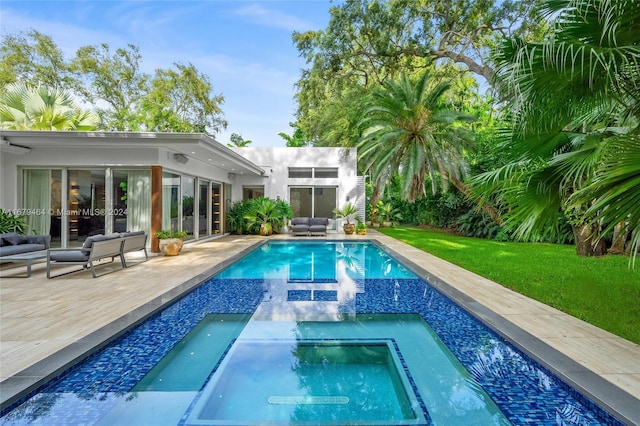 view of swimming pool with a yard, a patio area, and an in ground hot tub