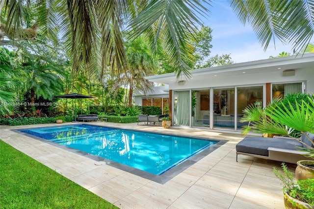 view of swimming pool featuring a patio