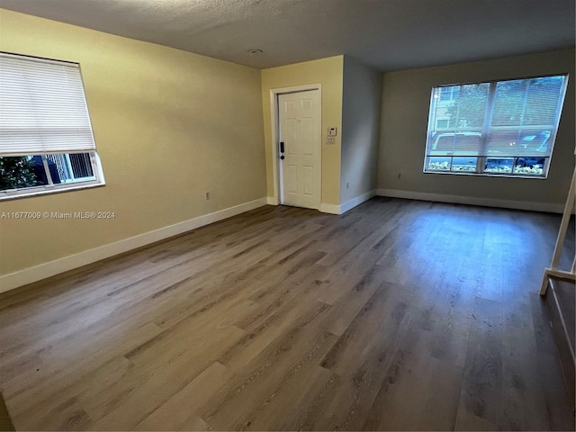 unfurnished room featuring wood-type flooring