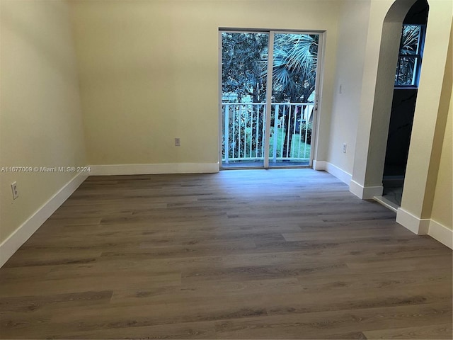 empty room with hardwood / wood-style floors