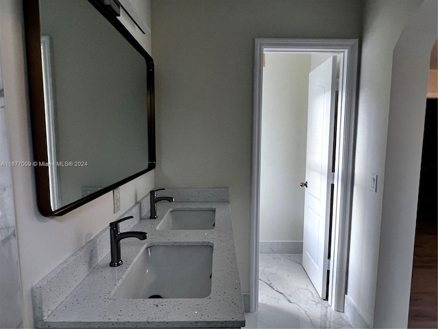 bathroom with vanity and hardwood / wood-style floors