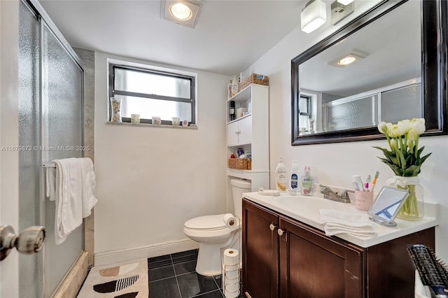 bathroom with tile patterned flooring, an enclosed shower, vanity, and toilet