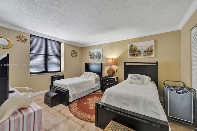 tiled bedroom with a textured ceiling and ornamental molding