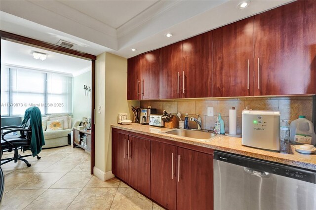 kitchen featuring sink, ornamental molding, stainless steel dishwasher, light tile patterned floors, and decorative backsplash