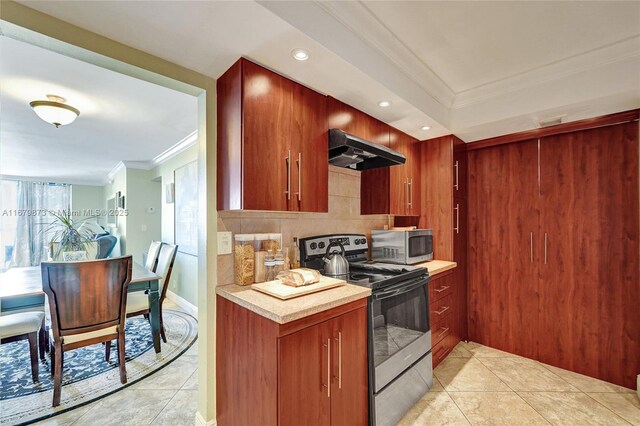 kitchen with ornamental molding, extractor fan, light tile patterned floors, appliances with stainless steel finishes, and decorative backsplash