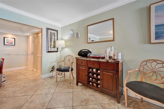 interior space with ornamental molding and light tile patterned floors