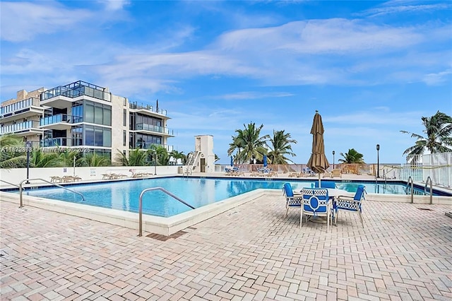 view of pool featuring a patio area