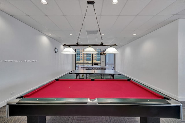 recreation room with a paneled ceiling