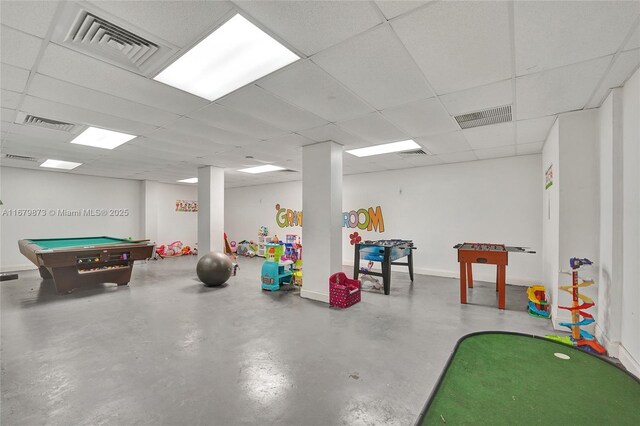 game room with concrete flooring, billiards, and a drop ceiling